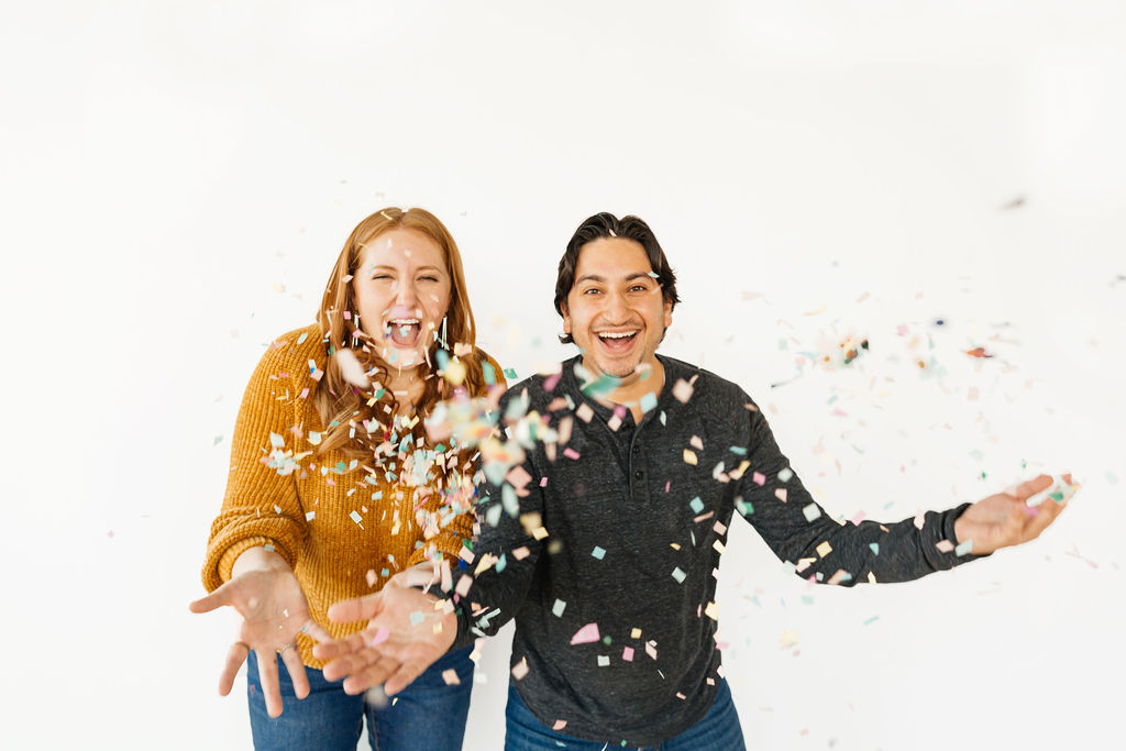 Julia and Tony, videographers of Zeitlos Studios, throwing confetti